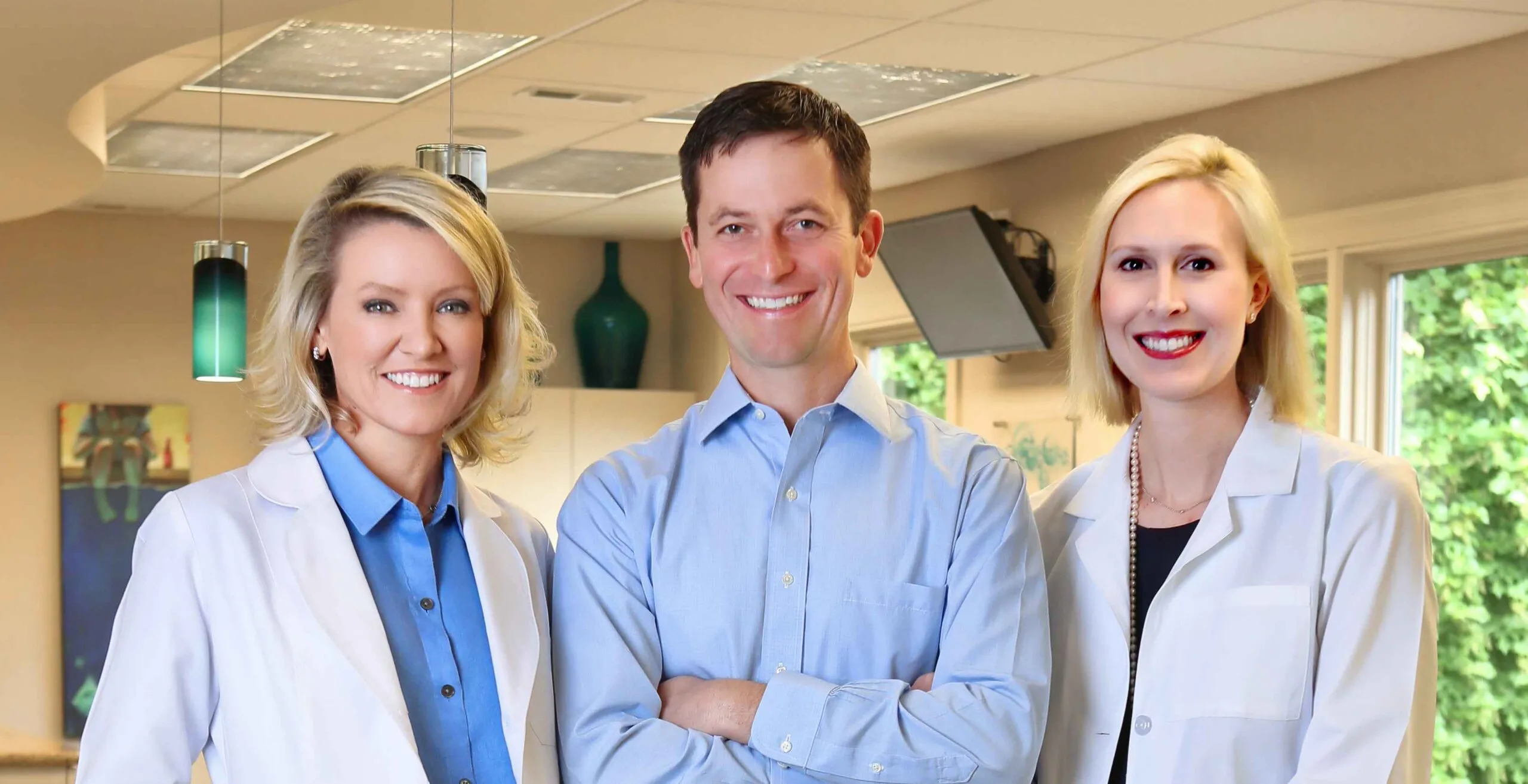 Dr. Mitchell, Dr. Bartlett, Dr. Bell with smile face