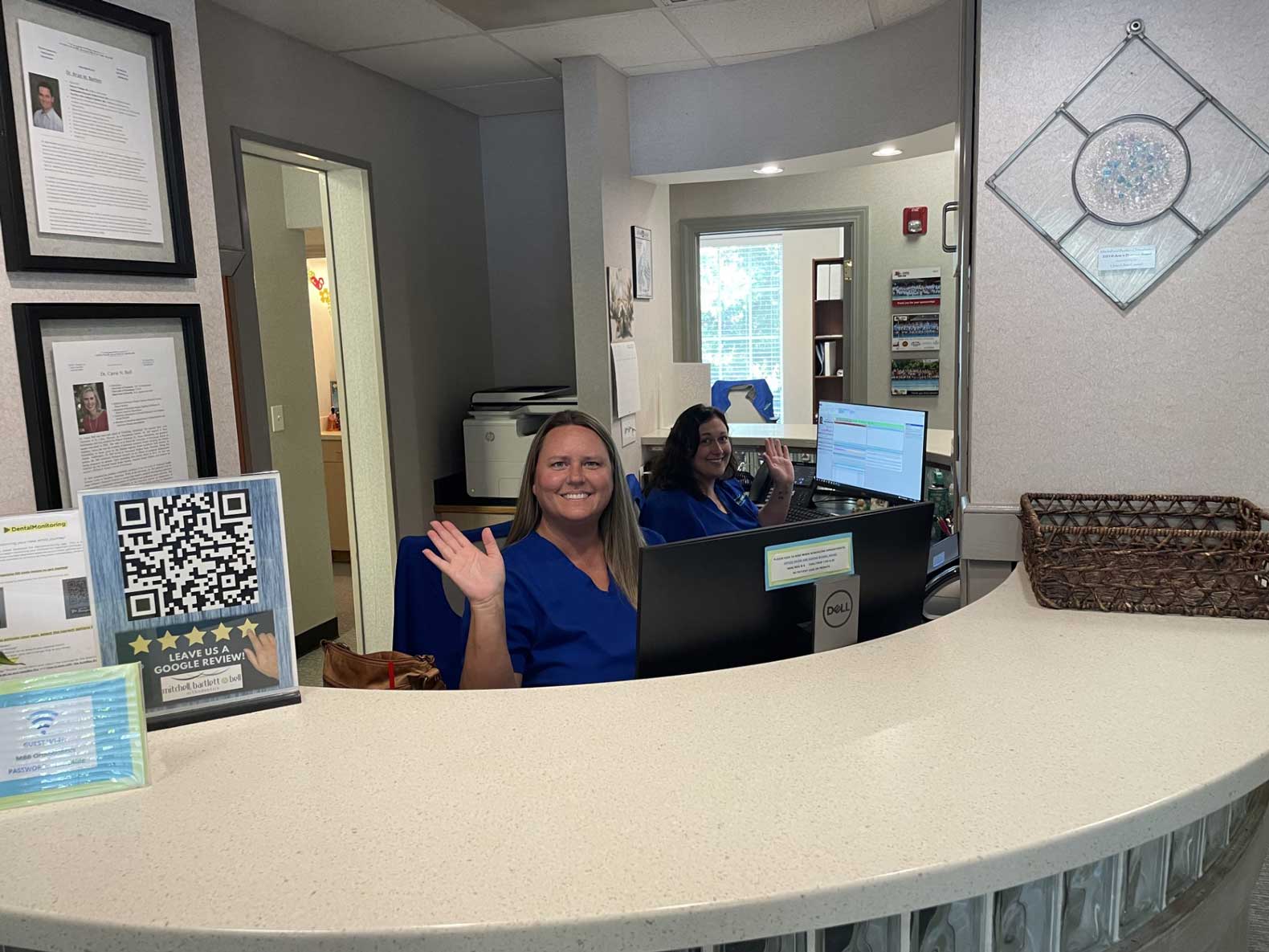 Mitchell, Bartlett & Bell Orthodontics office desk with two women